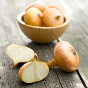 Golden Gourmet shallots on a wooden surface