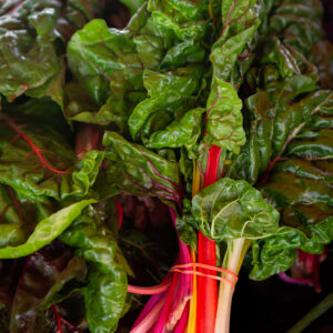 Fresh red Swiss Chard at an outdoor farmer's market